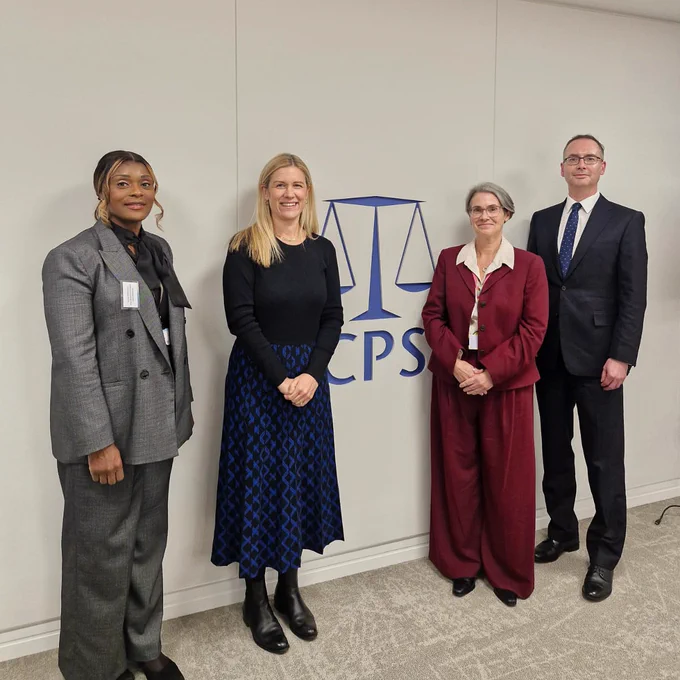 Ellie posing for a photo with CPS staff 